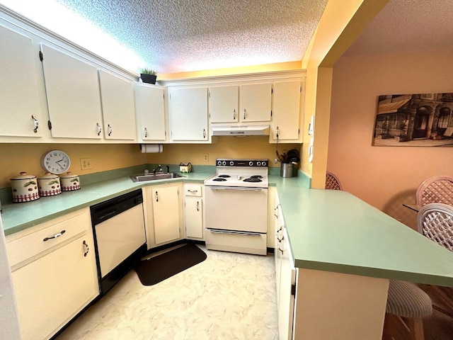 kitchen with sink, a textured ceiling, white appliances, and kitchen peninsula