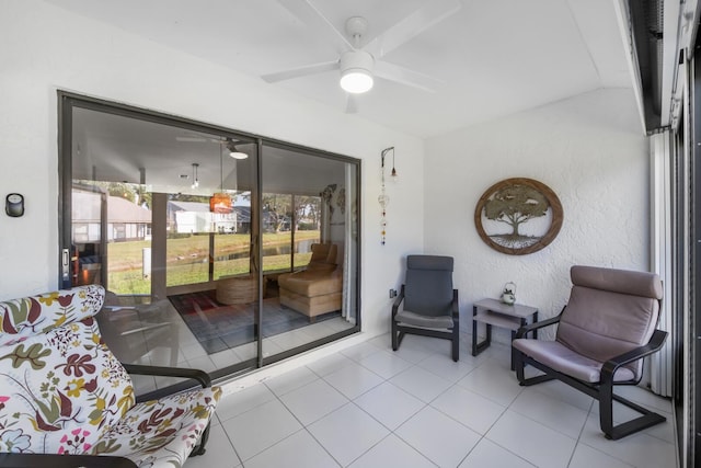 interior space with ceiling fan and light tile patterned flooring