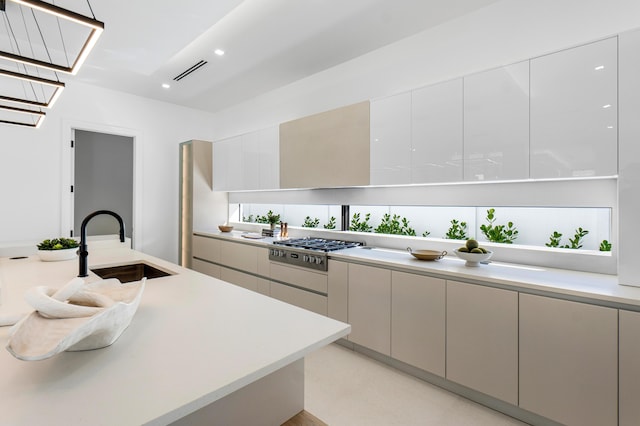 kitchen featuring stainless steel gas cooktop and sink