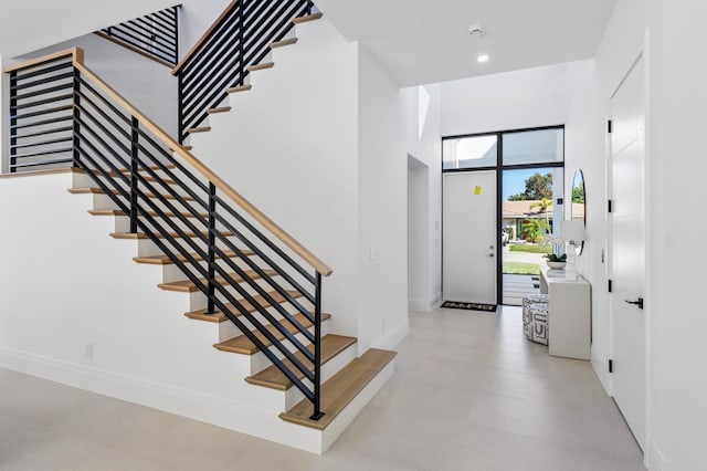 foyer with a towering ceiling