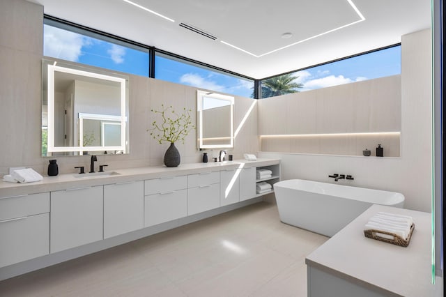 bathroom with vanity and a bathtub