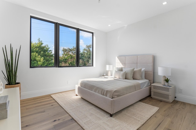 bedroom with light hardwood / wood-style flooring