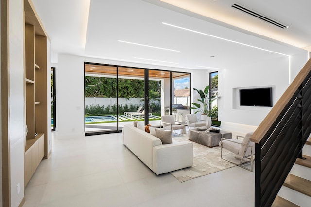 living room featuring floor to ceiling windows