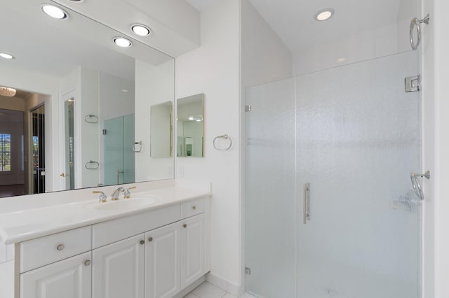 full bathroom featuring recessed lighting, a shower stall, and vanity