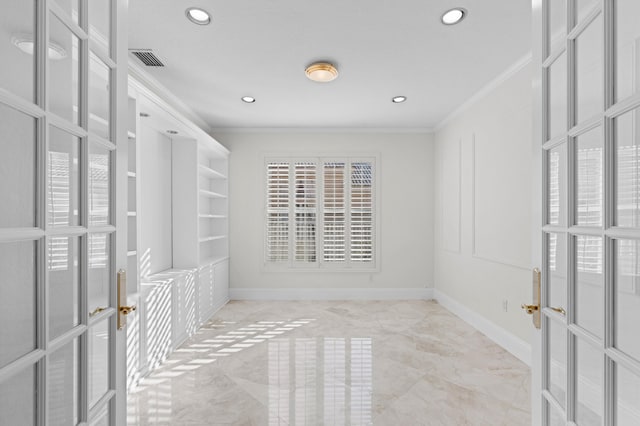 walk in closet with marble finish floor, french doors, and visible vents