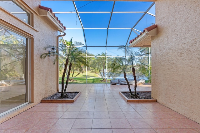 view of patio / terrace featuring glass enclosure