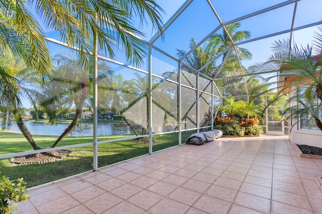 unfurnished sunroom featuring a water view