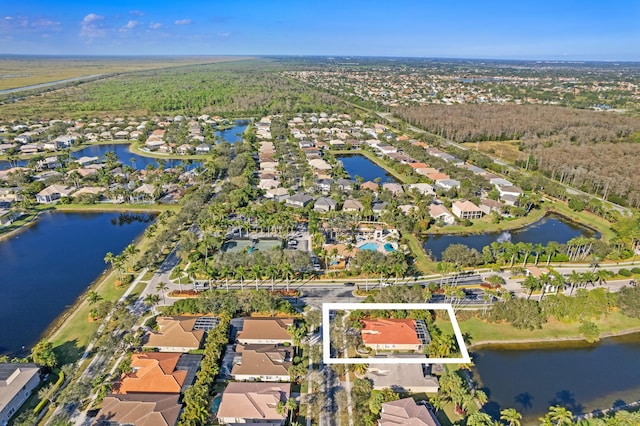 aerial view featuring a residential view and a water view