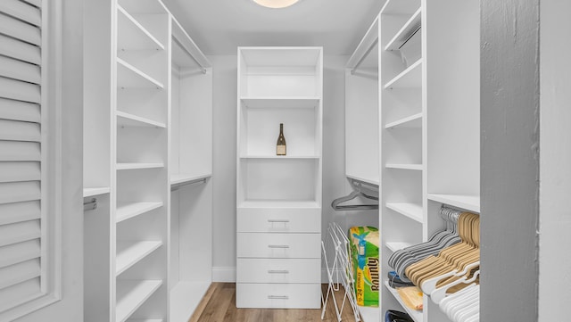 walk in closet featuring hardwood / wood-style floors