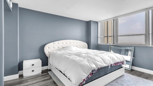 bedroom featuring dark hardwood / wood-style flooring