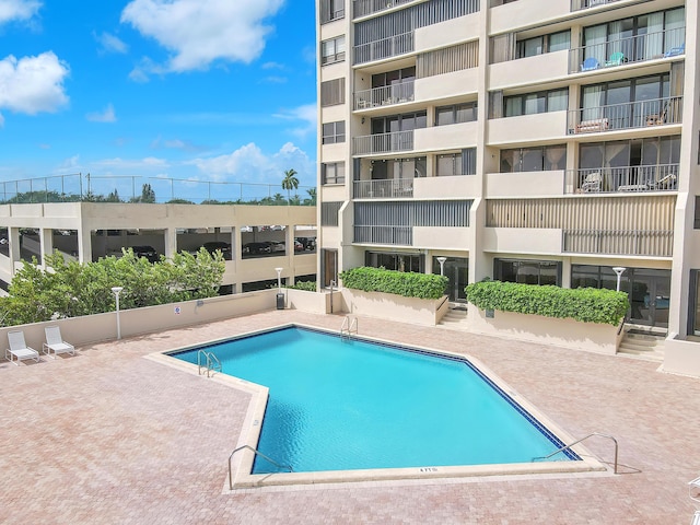 view of swimming pool with a patio