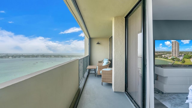 balcony featuring a water view