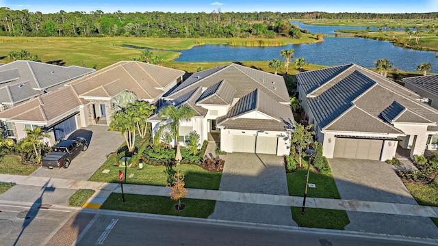 birds eye view of property with a water view