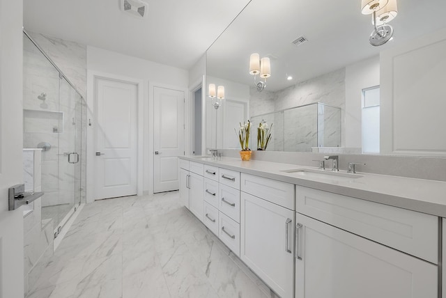 bathroom featuring vanity and a shower with shower door