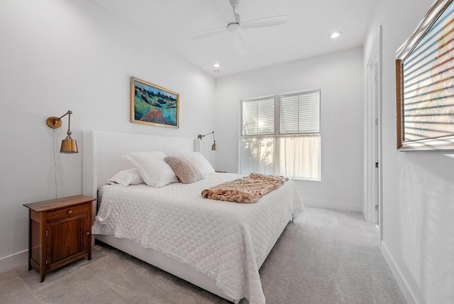 bedroom with ceiling fan and light colored carpet