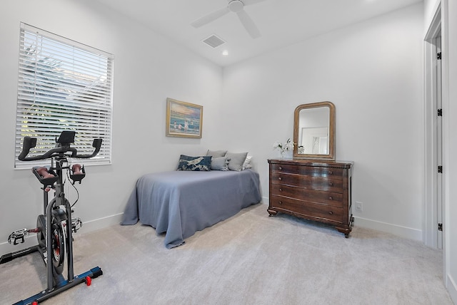 bedroom featuring light carpet and ceiling fan