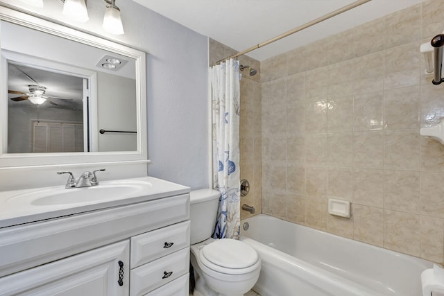 full bathroom featuring ceiling fan, vanity, toilet, and shower / bath combo with shower curtain