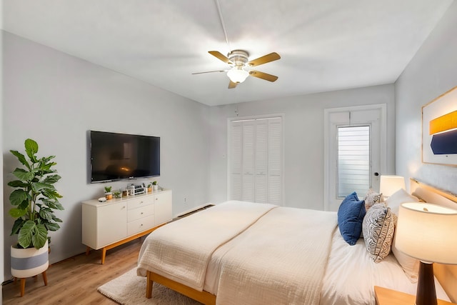 bedroom featuring light hardwood / wood-style floors and ceiling fan