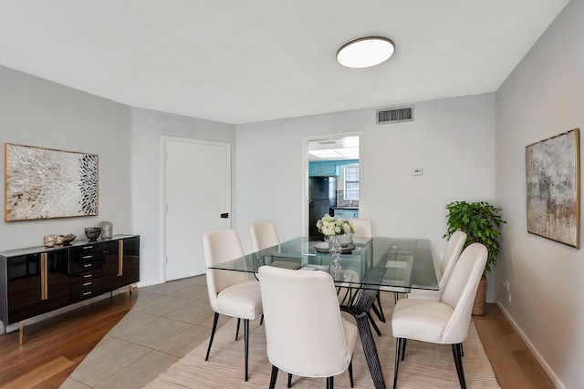 dining space featuring hardwood / wood-style floors