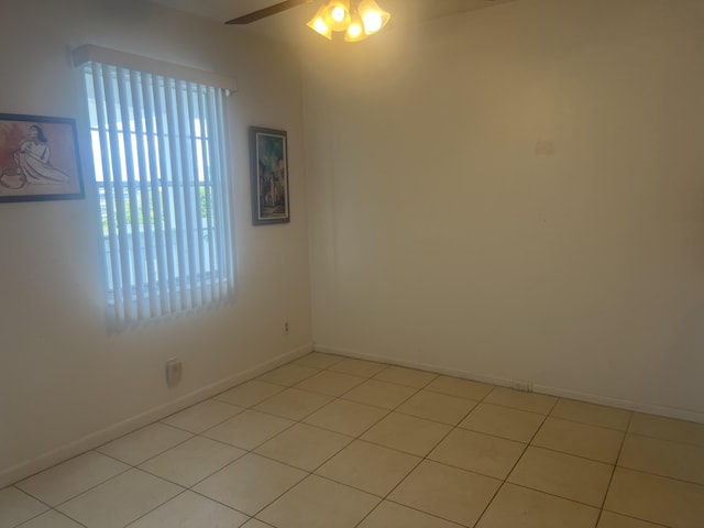 4034 Exeter Unit B, Boca Raton, FL 33434 - empty room with ceiling fan, baseboards, and light tile patterned flooring