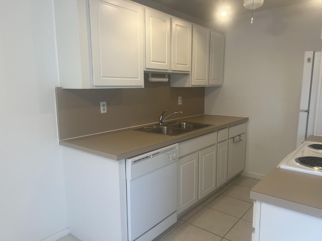 4034 Exeter Unit B, Boca Raton, FL 33434 - kitchen featuring a sink, white appliances, white cabinetry, and light tile patterned floors