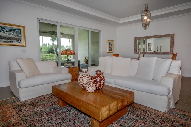 living room featuring crown molding and wood finished floors