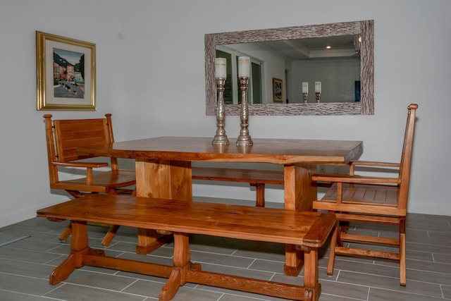 dining room with wood tiled floor and baseboards