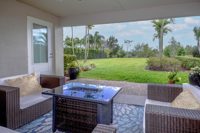 view of patio / terrace with an outdoor living space with a fire pit