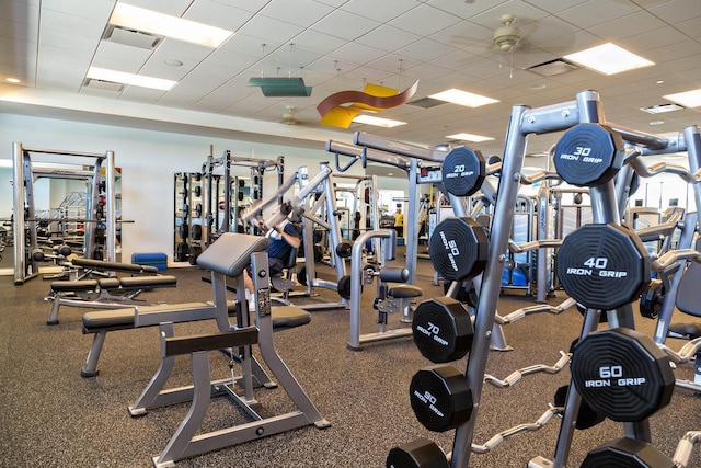 workout area with a drop ceiling and visible vents