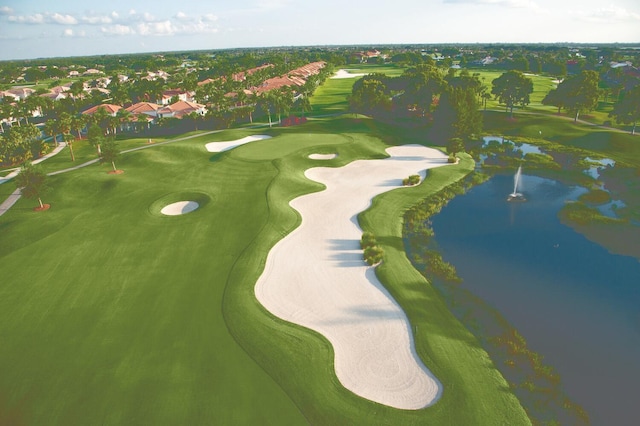 aerial view featuring view of golf course and a water view