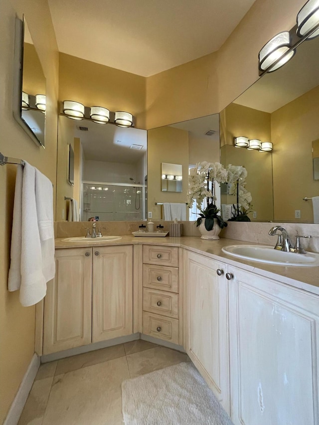 663 Hibiscus St, West Palm Beach, FL 33401 - bathroom featuring tile patterned floors, a shower with door, and vanity