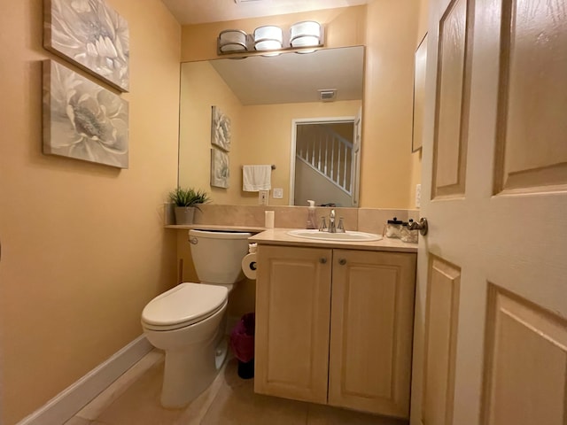 663 Hibiscus St, West Palm Beach, FL 33401 - bathroom featuring vanity, tile patterned flooring, and toilet