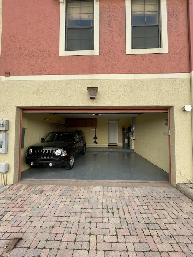 663 Hibiscus St, West Palm Beach, FL 33401 - garage featuring electric water heater
