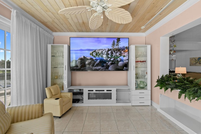 home theater room with ornamental molding, light tile patterned floors, wooden ceiling, and ceiling fan