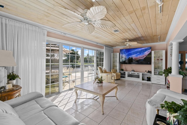 sunroom with decorative columns, ceiling fan, and wood ceiling