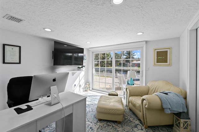 office area featuring a textured ceiling