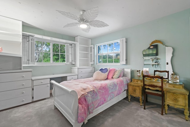 carpeted bedroom with ceiling fan