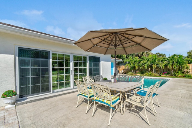 view of patio featuring a fenced in pool