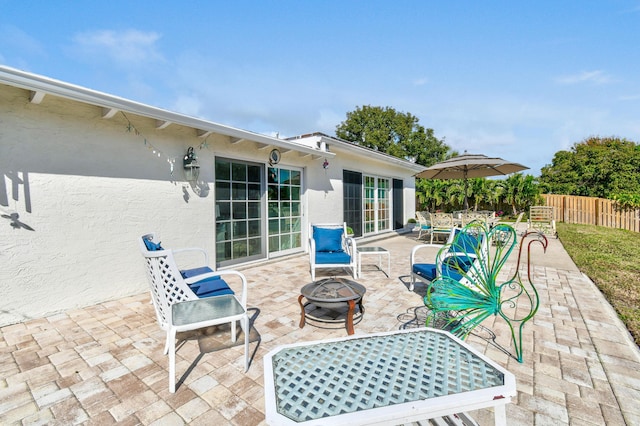 view of patio / terrace featuring an outdoor fire pit