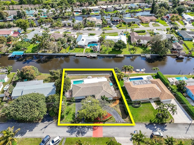 birds eye view of property with a water view