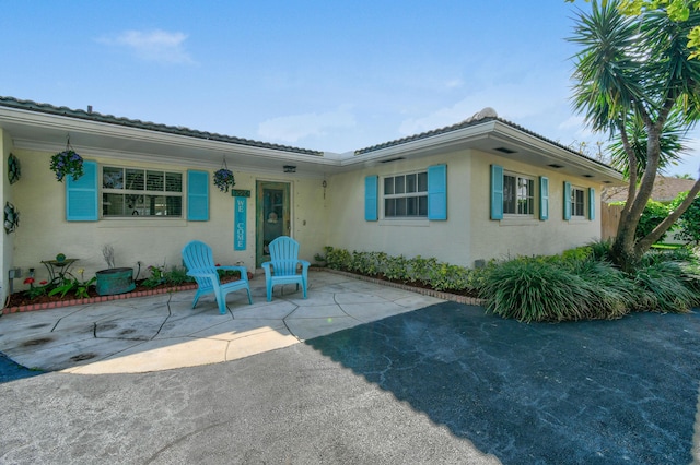 view of front of home with a patio area