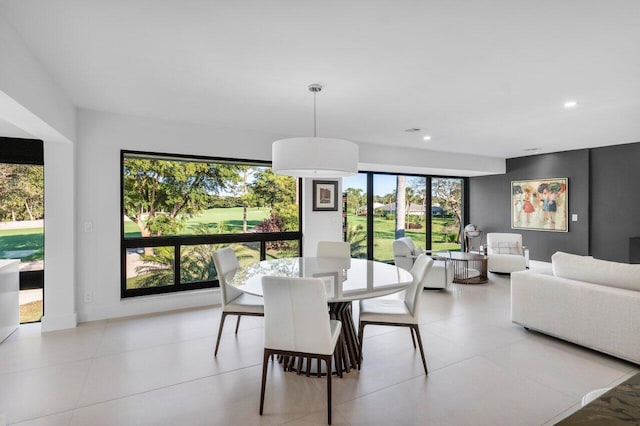 dining space with baseboards and recessed lighting