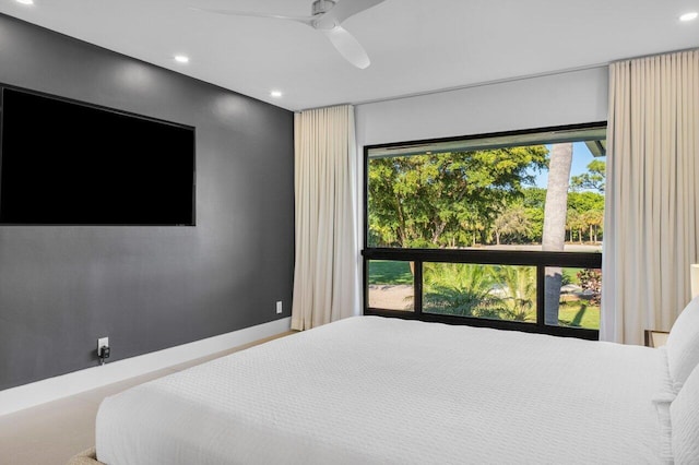 bedroom with a ceiling fan, recessed lighting, and baseboards