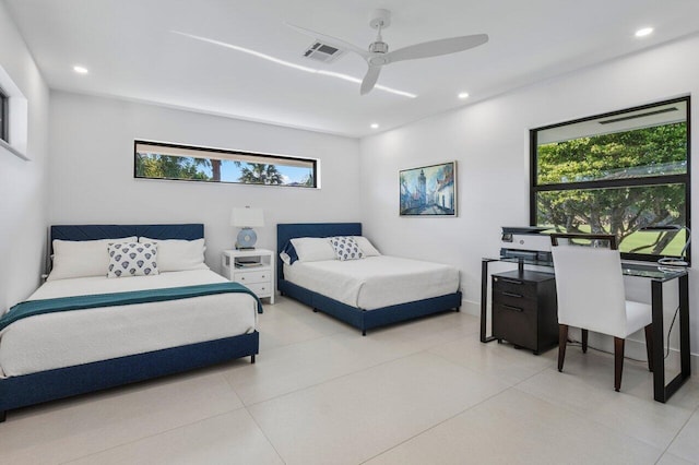 bedroom featuring multiple windows, ceiling fan, and light tile patterned flooring