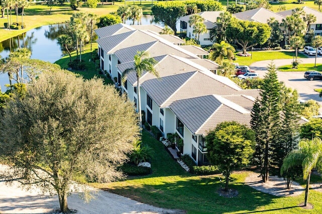 bird's eye view featuring a water view and a residential view