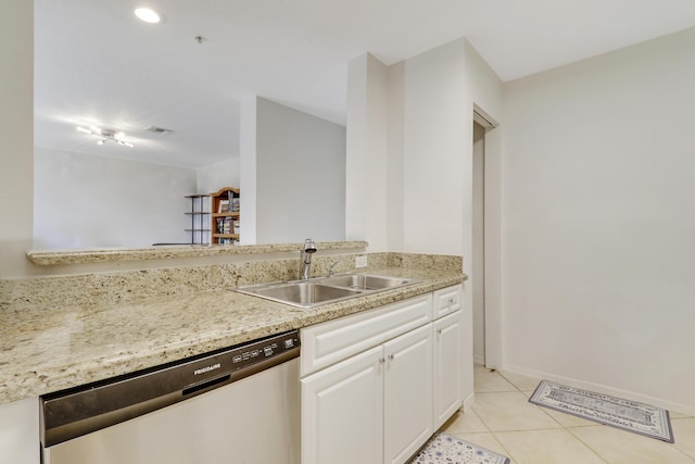 kitchen featuring light tile patterned flooring, stainless steel dishwasher, sink, and white cabinets