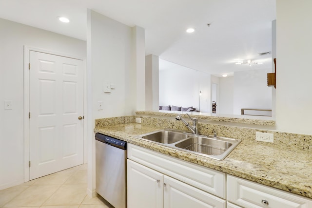 kitchen featuring white cabinetry, sink, light tile patterned floors, and dishwasher