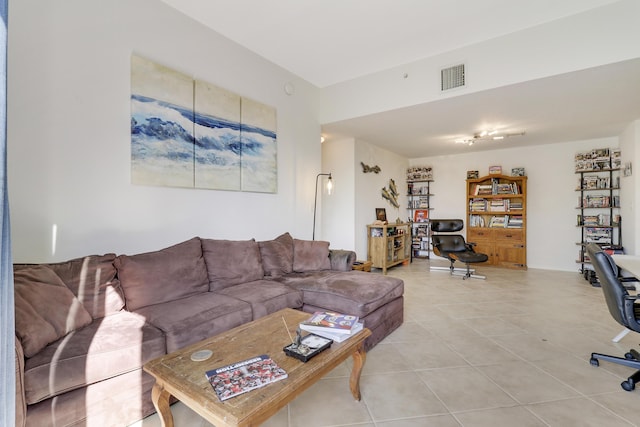 living room with tile patterned floors