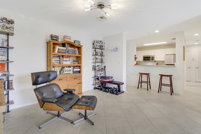 sitting room with light tile patterned floors