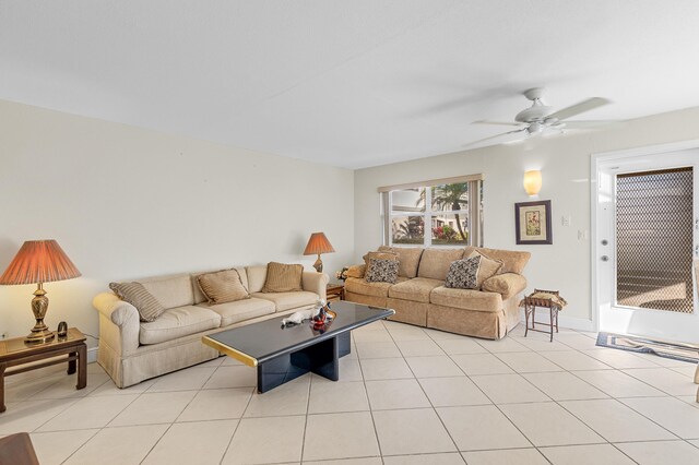 living room with light tile patterned floors and ceiling fan